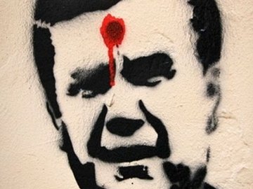 Українця посадять на рік за графіті з Януковичем