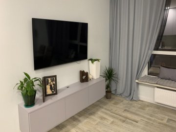 Оздоблення вітальні декоративним каменем - види і варіанти виконання*